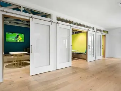 a room with white sliding doors in a room with a table at Blueground Burbank pool bbq nr studios LAX-1321 in Los Angeles