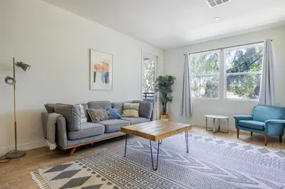 a living room with a couch and a table at Blueground Playa Vista pool AC nr beach LAX-1353 in Los Angeles
