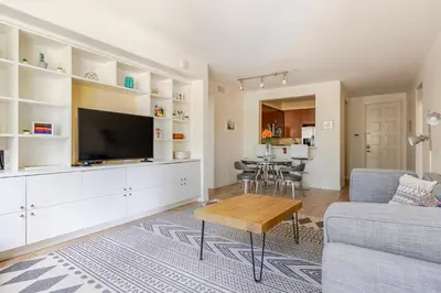 a living room with a couch and a tv at Blueground Playa Vista pool AC nr beach LAX-1353 in Los Angeles