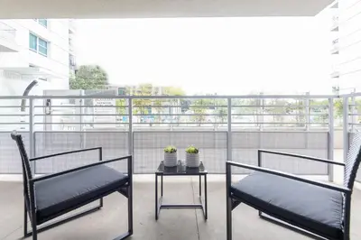 two chairs and a table on a balcony at Vista Point Suites in Los Angeles