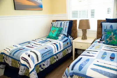 a bedroom with two twin beds and a night stand at 4980 Sandyland Road #216 in Carpinteria