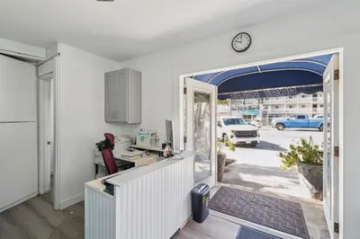 an office with a door open to a yard at 2 Bed Beach Condo #125 in Carpinteria
