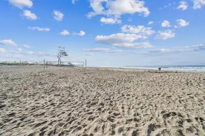 a sandy beach with a soccer ball and a goal at Beach Condo with Private Patio #135 in Carpinteria