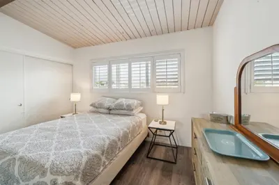 a bedroom with a bed and a bath tub at Beautiful 1 Bed Beach Condo #224 in Carpinteria