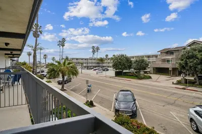 a balcony with a car parked on the street at Beach Condo with Private Ocean View Balcony #237 in Carpinteria