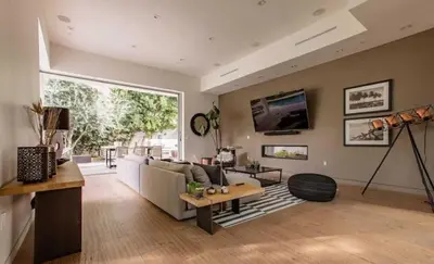 a living room with a couch and a table at Stunning Home - Pool & Hot Tub - Fire Pit in Los Angeles
