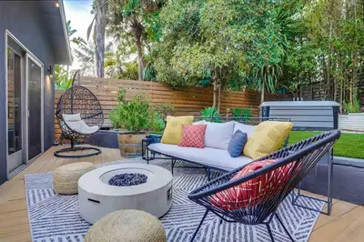 a patio with a couch and a chair at Projector - Pool Table - 15min DT - Pets OK - BBQ in Los Angeles