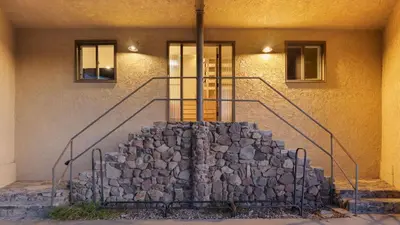 a building with a stone staircase in front of a building at Designer Retreat w Pool Firepits Panoramic Views The Lake House at Malibu in Agoura Hills