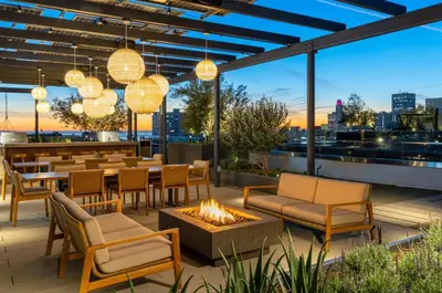 a patio with tables and chairs and a fire pit at The Diamond Dune Three floors Two Balconies BBQ in Los Angeles