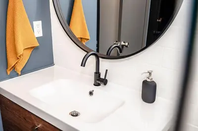 a bathroom with a sink and a mirror at NEW and Modern Cozy Flat in Southern California in Covina
