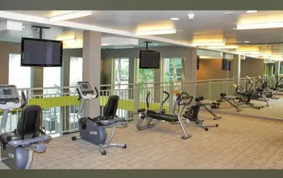 a gym with a bunch of exercise bikes in it at Cozy 2BR Apt in Downtown LA with Pool & Hot Tub in Los Angeles