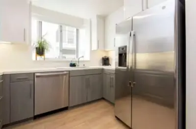a large kitchen with a stainless steel refrigerator at Walk to Santa Monica Beach Pier Boardwalk Venice in Los Angeles