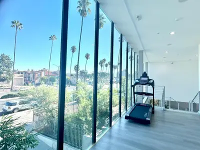 a room with a view of a building with palm trees at Modern New Studio Cozy&Prime Location in North Sherman Way