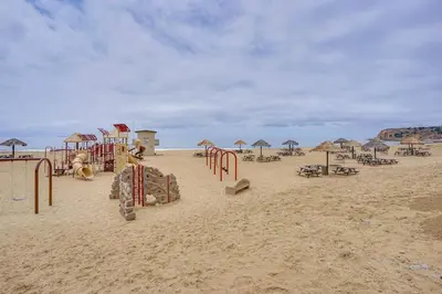a playground on the beach with umbrellas and chairs at Walk to Private Beach Rancho Palos Verdes Escape! in Rancho Palos Verdes