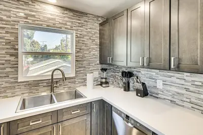 a kitchen with a sink and a window at 4 Mi to SoFi Stadium Pet-Friendly LA Area Home in Los Angeles