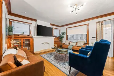a living room with a couch and a tv at Bright Coastal Escape 4 Bedroom 2 Bath Near CSULB Long Beach Airport and Beach in Long Beach