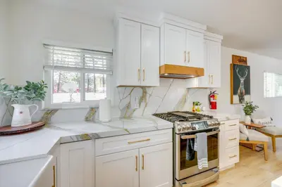 a kitchen with white cabinets and a stove top oven at Walk to The Village ShopsandEats Big Bear Lake Home in Big Bear Lake