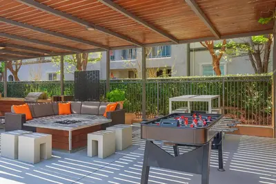 a outdoor patio with a table and a chess board at Premier Suites at Marina-Venice with Luxe Pool, Gym & Hot Tub & More in Los Angeles