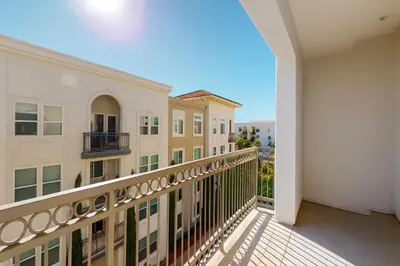 a balcony with a view of a building at Premier Suites at Marina-Venice with Luxe Pool, Gym & Hot Tub & More in Los Angeles