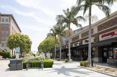 a street with palm trees in front of a building at Culver City 1BR w Pool Gym WD nr Downtown LAX-173 in Los Angeles
