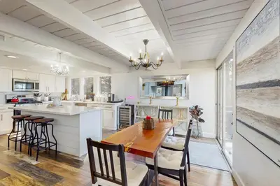 a kitchen with a wooden table and chairs at Cielo Ridge in Twin Peaks