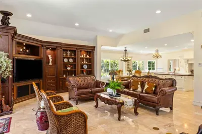 a living room with leather furniture and a tv at #Marbella Lane - Tranquil Country Escape Getaway in Placentia