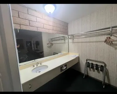 a bathroom with a sink and a mirror at Circle Inn Hotel - Jurupa Valley Riverside 60 Fwy in Riverside