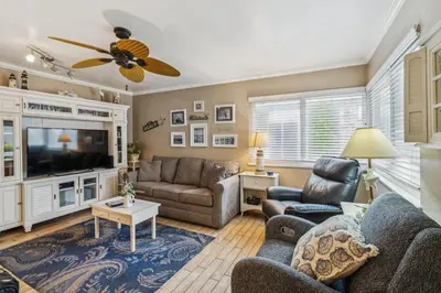 a living room with couches and a tv at Beautiful 1 Bed Beach Condo #122 in Carpinteria