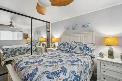 a bedroom with two beds and a mirror at Beautiful 1 Bed Beach Condo #122 in Carpinteria