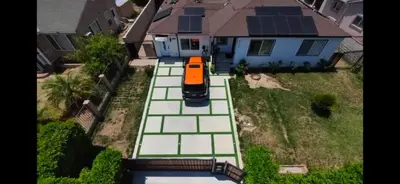 an aerial view of a car parked on a tennis court at WG House Winnetka Los Angeles in Winnetka