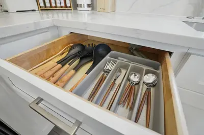 a drawer in a kitchen with utensils at La Tierra House 15 Min to Beach Movie Lounge in Hawthorne