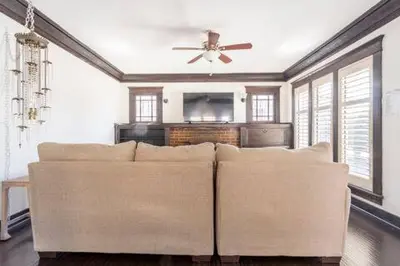 a living room with a couch and a ceiling fan at Urban Casita in Los Angeles