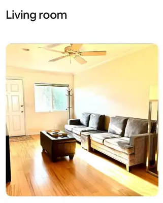 a living room with a couch and a table at 2 bed 2 bath East Village condo with two parking spots and 3 blocks to Ocean in Long Beach