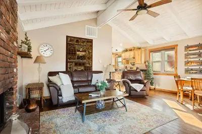 a living room with a couch and a table at Alpine Crest in Big Bear Lake in Big Bear Lake