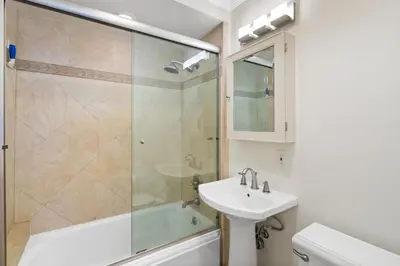 a bathroom with a sink and a shower at The Andalusite - Oceanfront Steps from the Sand in Los Angeles