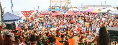 a large crowd of people at a carnival at The Andalusite - Oceanfront Steps from the Sand in Los Angeles