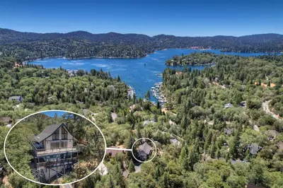 an aerial view of a house and a lake at Casa Del Lago - Spacious 4 Story Gated Home in Lake Arrowhead