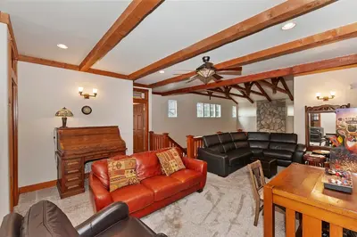 a living room with a couch and a table at Matternhorn Peak Lodge - For 10 in Lake Arrowhead