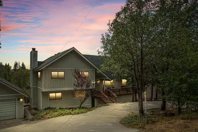 a house with a porch and a driveway at Our Secret Getaway - Two Spacious Living Areas in Lake Arrowhead