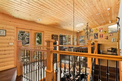 a log cabin with a wooden ceiling and a balcony at Summit Pine Lodge - 2 Minutes to Snow Summit in Big Bear Lake