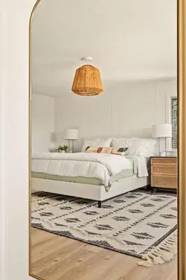 a bedroom with a large bed and a mirror at The Lilypad - 2 Master Bedrooms & Game Room in Lake Arrowhead