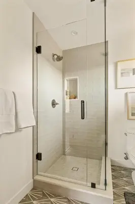 a shower with a glass door in a bathroom at The Lilypad - 2 Master Bedrooms & Game Room in Lake Arrowhead
