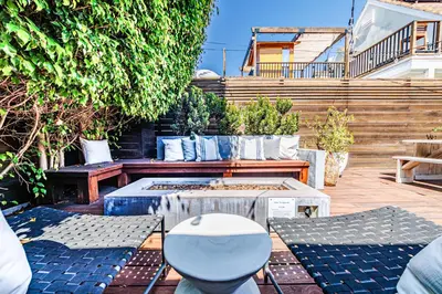 a patio with benches and a toilet in a yard at Venice 2BR - Ocean Walk with Stunning Outdoor Space! in Los Angeles