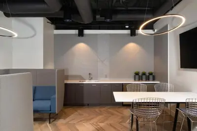 a kitchen with a table and chairs and a sink at Blueground Venice pool AC nr beach LAX-1330 in Los Angeles