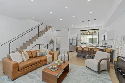 a living room with a couch and a table at Serene Hollywood in Los Angeles