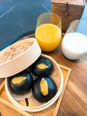 a bowl of eggs and a glass of orange juice at Boy Travel in Hewitt