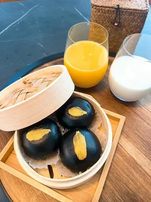 a bowl of eggs and a glass of orange juice at Boy Travel in Hewitt