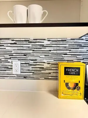 a yellow box on a shelf with cups on it at Heart of Koreatwon, 1Bed Studio in Los Angeles