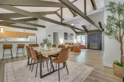 a dining room and living room with a table and chairs at Ski, Hike and Explore! Twin Peaks Cabin with Deck in Twin Peaks