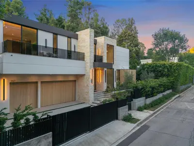 an exterior view of a house with a black fence at Hutton Villa in Los Angeles
